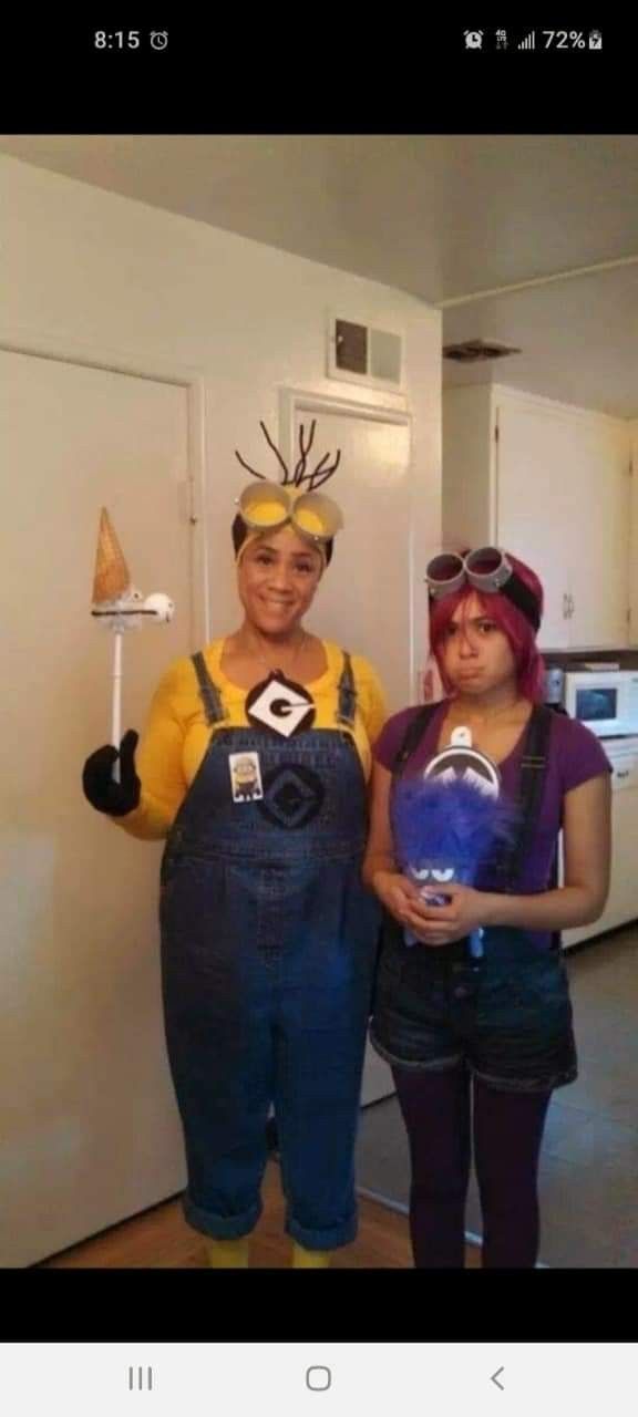 two people in costumes standing next to each other