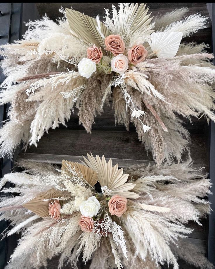 two wreaths decorated with flowers and feathers