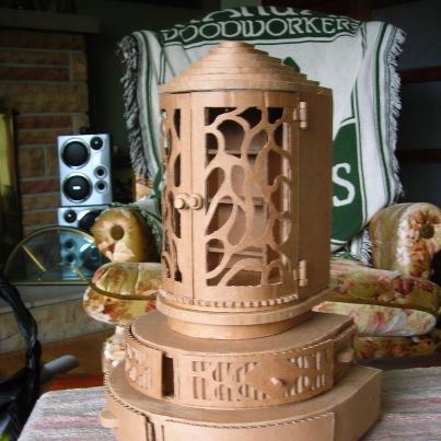 a decorative birdcage sitting on top of a table