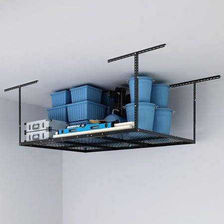 there is a shelf that has some blue containers on it and two lights above the shelves