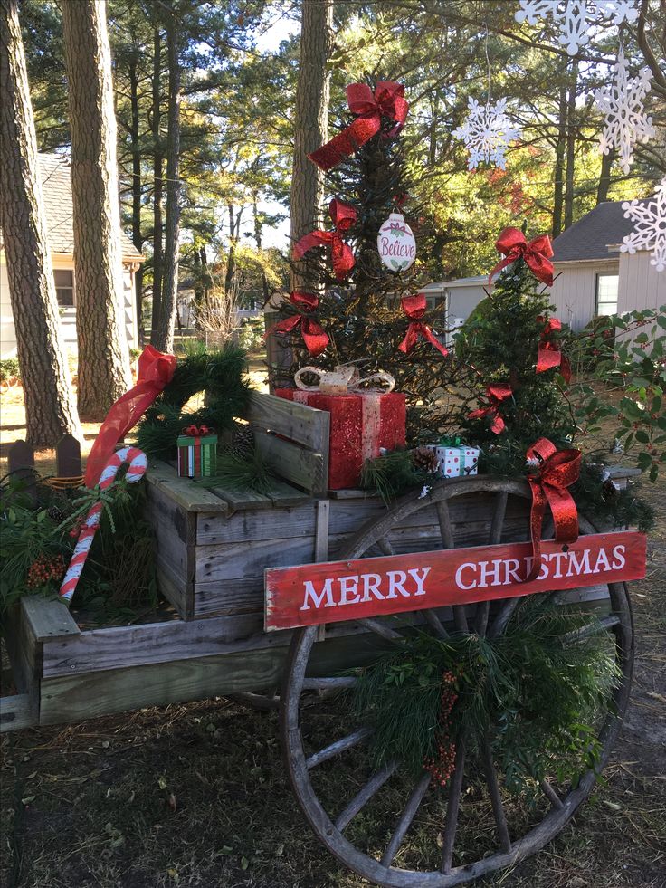 an old wooden wagon with christmas decorations on it