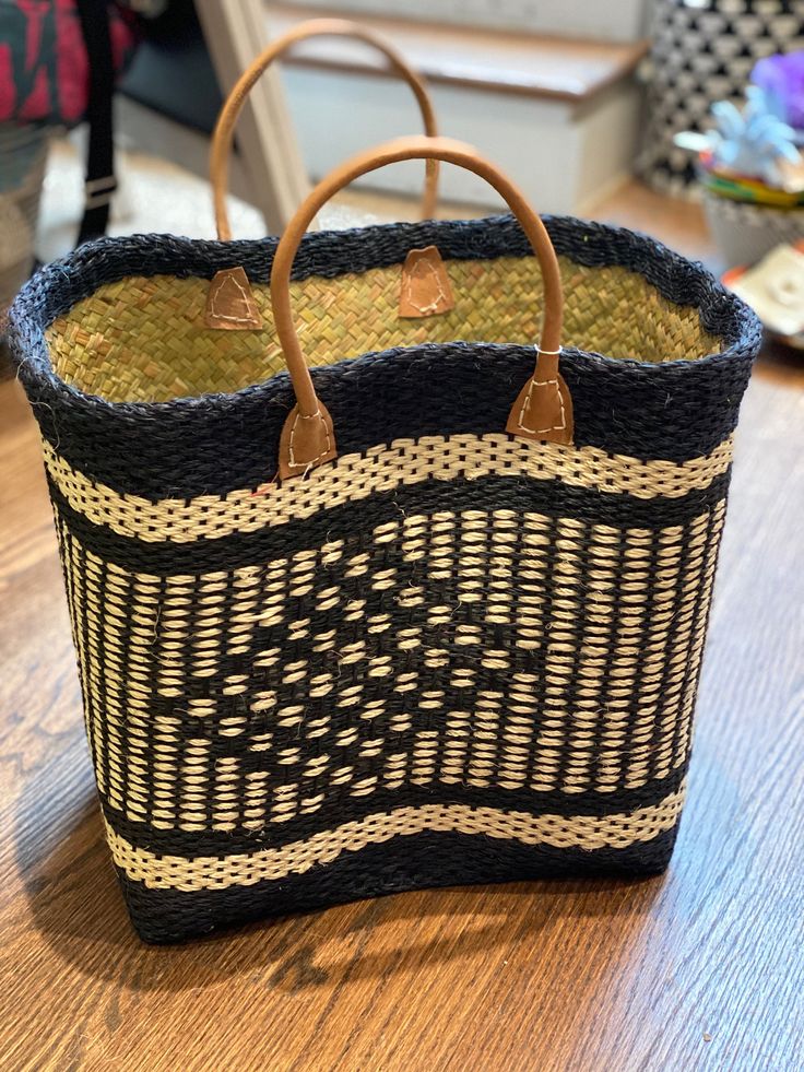 These gorgeous sisal bags are designed and produced in Cape Town South Africa. Each one is handmade and one of a kind, meaning slight variations in color and design. Black Woven Beach Bag Made Of Natural Fiber, Black Handwoven Natural Fiber Beach Bag, Black Basket Beach Bag For Daily Use, Black Basket Straw Bag For Daily Use, Eco-friendly Black Rectangular Beach Bag, Black Basket Beach Bag In Natural Fiber, Black Natural Fiber Basket Beach Bag, Eco-friendly Handmade Black Crochet Bag, Black Straw Bag For Market