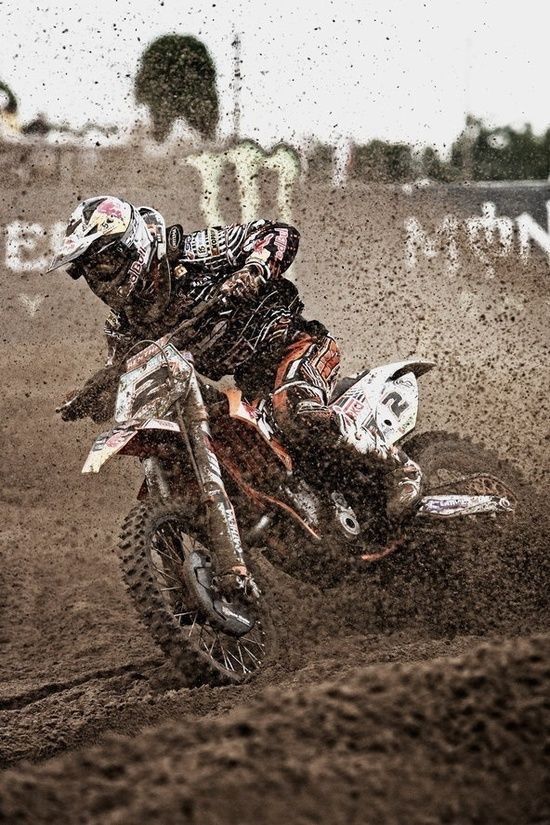 a man riding on the back of a dirt bike