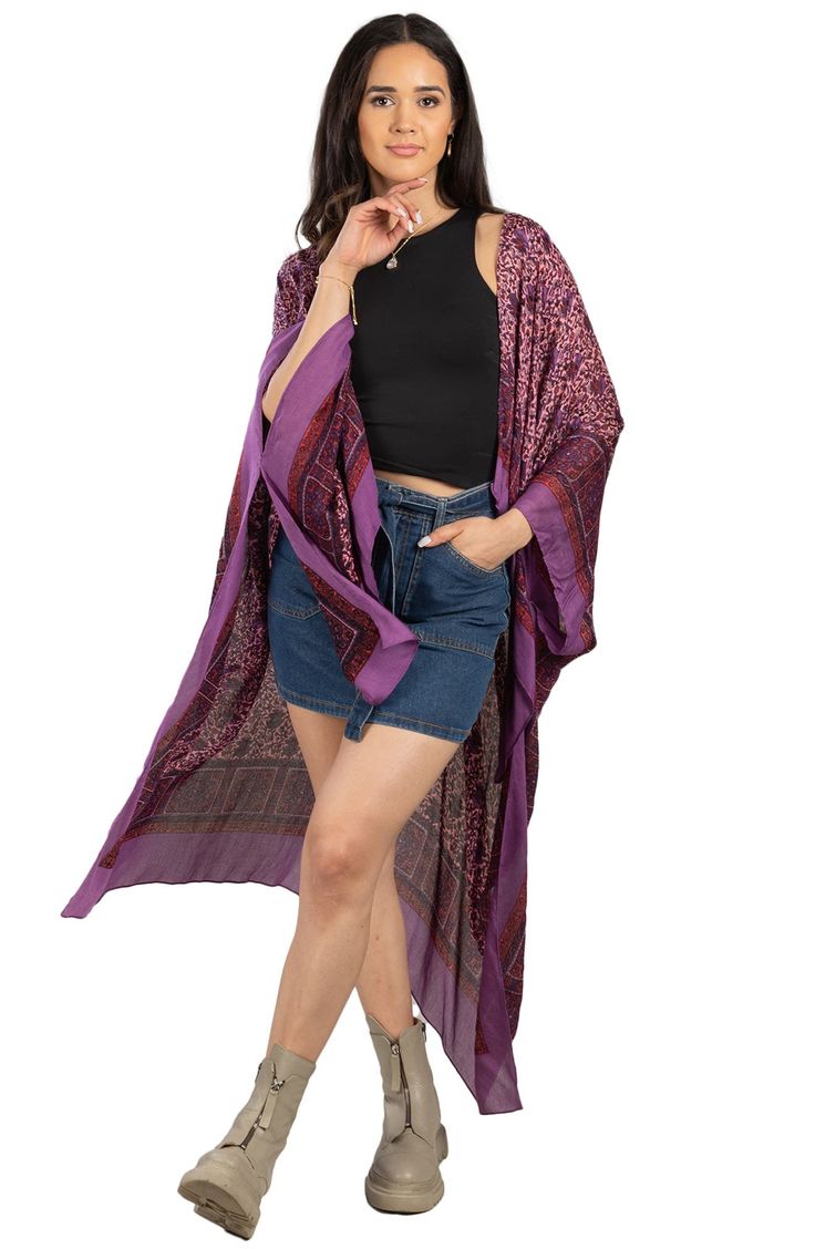 Transform any outfit with this lightweight ruana featuring a tapestry-inspired floral print and contrast border for chic boho style. Open front 100% polyester Hand wash, line dry Imported Model stats: 5'10" height, 32" bust, 25" waist, 36" hip. Model is wearing size One Size. Bohemian Purple Kimono For Spring, Purple Bohemian Kimono For Spring, Bohemian Long Kimono With Paisley Print, Long Bohemian Kimono With Paisley Print, Multicolor Bohemian Outerwear With Paisley Print, Bohemian Multicolor Paisley Print Outerwear, Bohemian Long Printed Outerwear, Bohemian Floral Print Shawl For Summer, Purple Bohemian Shawl For Fall