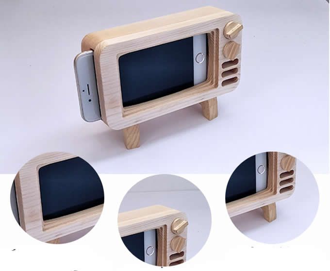 a wooden phone holder made out of an old tv