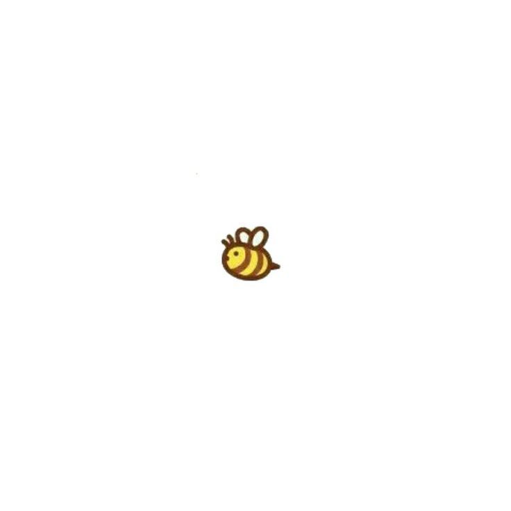 a small yellow bee sitting on top of a white wall