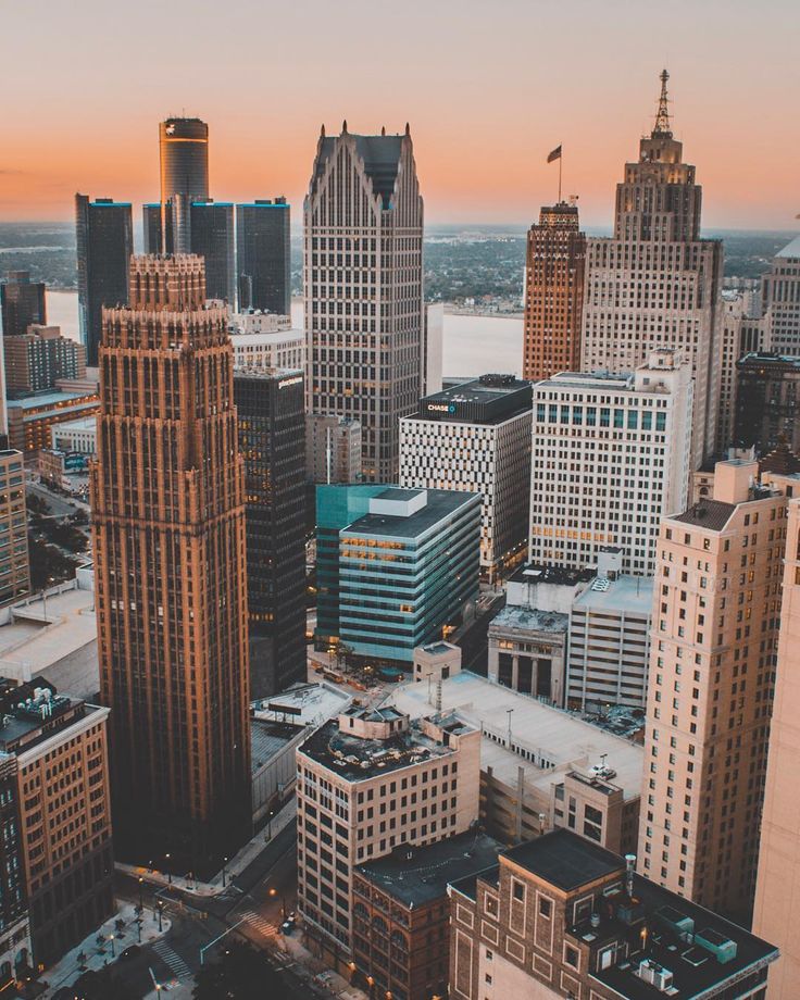 an aerial view of the city with tall buildings and skyscrapers in the foreground