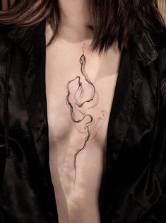 a woman with a tattoo on her chest