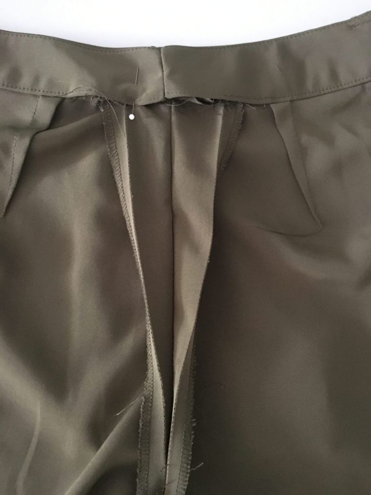 the side view of a pair of pants with zippers