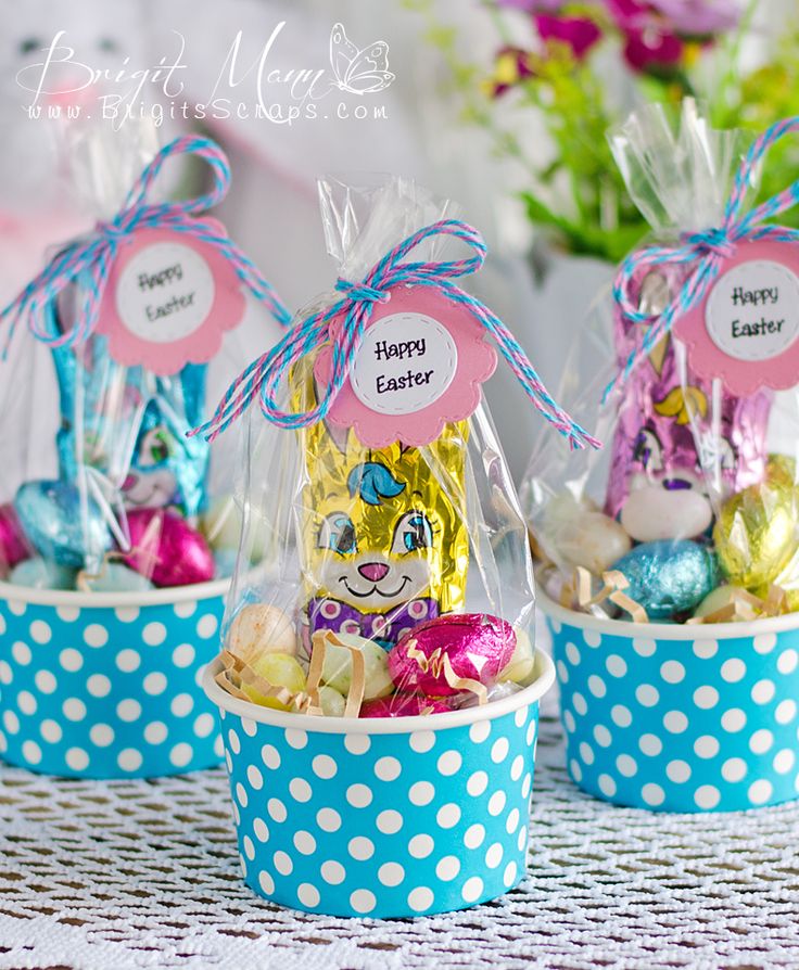 three baskets filled with candy and candies on top of a table