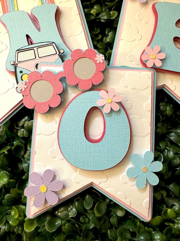 four cards with flowers and cars on them are arranged in the shape of a star