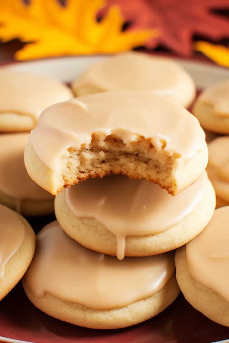 a plate full of iced cookies with frosting