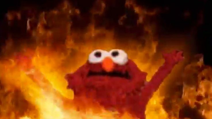 the sesame character is on fire with his arms in the air and eyes wide open