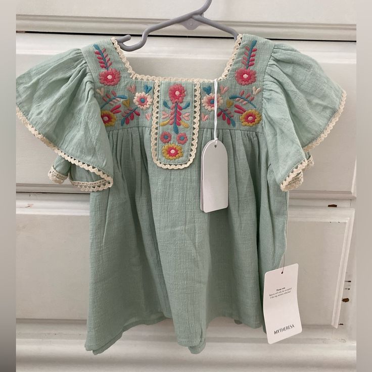 Nwt 3yr Louise Misha Yosana Blouse In Green Water 100% Cotton Similar To: Apolina Misha Puff Soor Ploom Rylee Cru House Of Paloma Multicolor Cotton Flutter Sleeve Top, Multicolor Cotton Tops With Flutter Sleeve, Embroidered Summer Tops For Playtime, Summer Flutter Sleeve Tops For Playtime, Cute Green Short Sleeve Blouse, Cotton Flutter Sleeve Tops For Playtime, Cute Blouse For Spring Playtime, Cotton Tops With Flutter Sleeves For Playtime, Cute Cotton Blouse With Flutter Sleeves