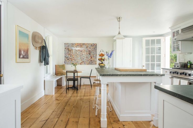 the kitchen is clean and ready to be used for cooking or eating, while also being used as a dining area