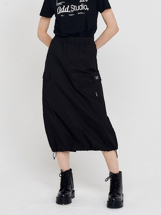 Editor's NotesIt is a long skirt with a unique Y2K mood silhouette. This item adds a comfortable fit with waistband and can be worn in two ways with the hem string.- Cargo pocket design- Banding on waist- Great to style in many ways- Versatile and daily itemMeasurements(in.)Size: 1(S) / 2(M)- Total length: 32.67 in. / 33.07 in.- Waist: 12.59 in. / 13.58 in.- Hip: 19.09 in. / 20.07 in.- Hem: 23.22 in. / 24.21 in.*Model Info- Iva: Height 5'61 / Wearing S sizeCompositi Cotton Long Skirt With Drawstring, Spring Black Cargo Skirt With Pockets, Black Cargo Skirt With Side Pockets For Spring, Casual Long Cargo Skirt With Pockets, Casual Long Cargo Skirt, Black Cargo Skirt With Pockets For Summer, Casual Black Cargo Skirt For Summer, Casual Long Skirt With Side Pockets, Black Cotton Utility Skirt