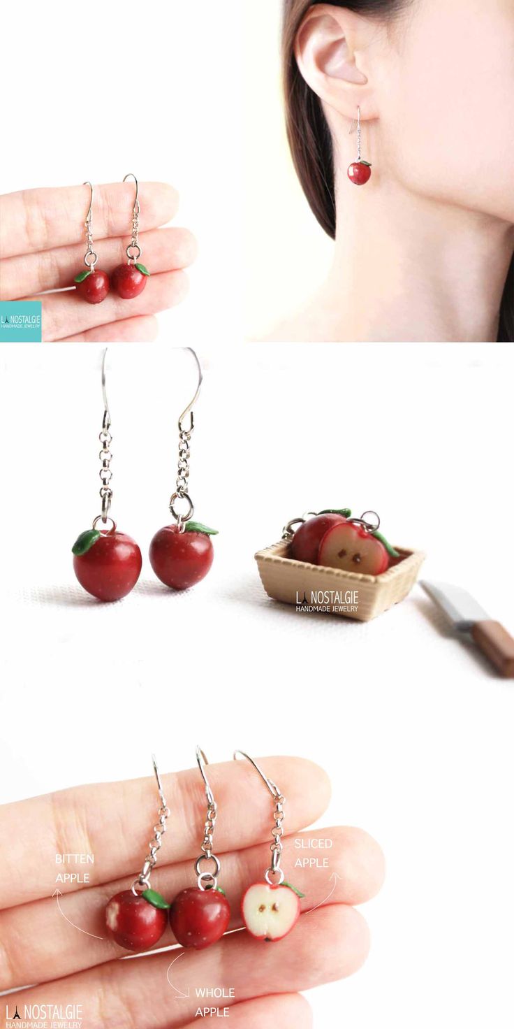 the cherry earrings are hanging from chains and have cherries attached to them, as if they were made out of fruit