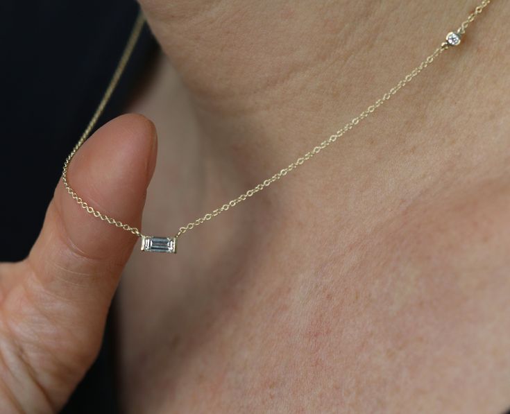 **Our diamonds are 100% REAL, natural earth mined** Pendant with 0.30 Carat of baguette-cut diamonds mounted in 14K Yellow Gold. non-traditional necklace with stunning horizontal baguette diamond that you will never take off! Setting -Total Carat Weight: 0.34 -14K White Gold -Size: Resizeable -Certificate Of Authenticity Included by www.gil-lab.com Main Diamond: -Round Brilliant -0.34 Carat -Color: F -Clarity: VS -Clarity Enhanced I would like to inform you that there may be a deviation of about Gold Necklace Diamond, Traditional Necklace, Oval Diamond Engagement, Natural Diamond Ring, Necklace Diamond, Art Deco Necklace, Yellow Gold Engagement, Baguette Cut Diamond, Jewelry Diamond