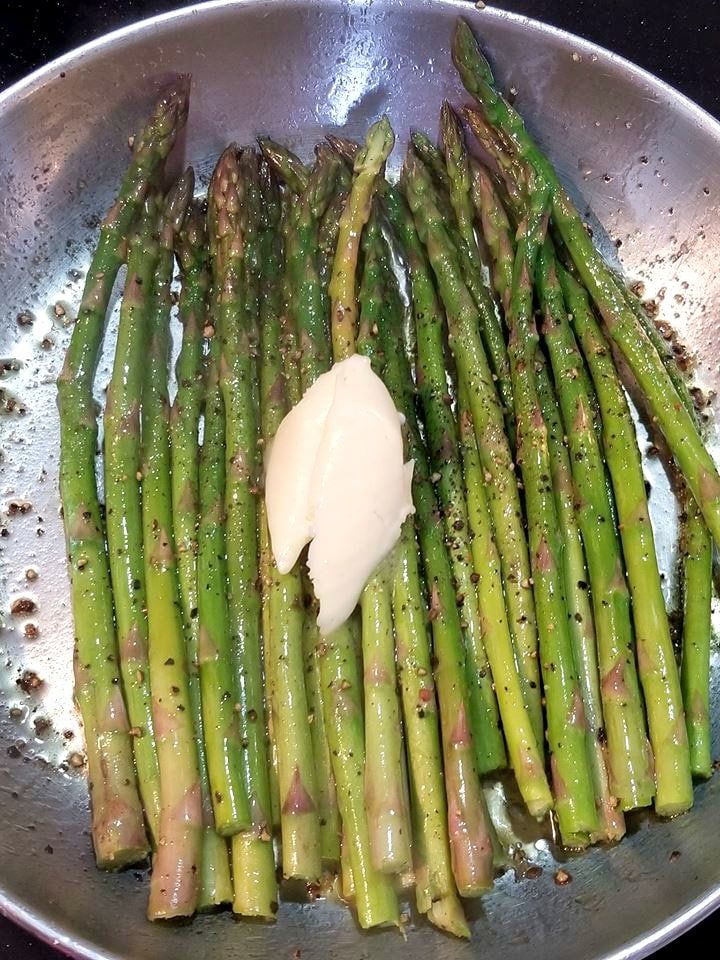 asparagus and mayonnaise in a pan on the stove