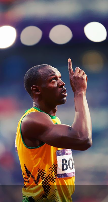 a male athlete in a yellow and green shirt is holding his hand up to the sky