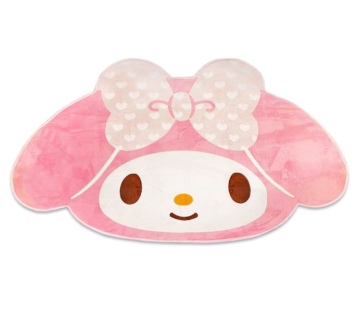 an animal shaped pillow with a bow on it's head and hearts in the background