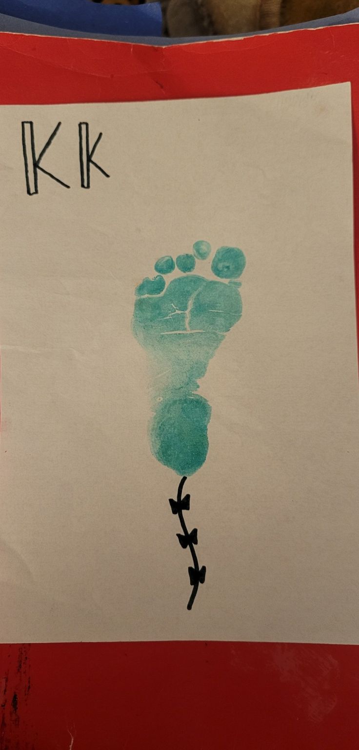 a child's hand and foot print on a piece of paper