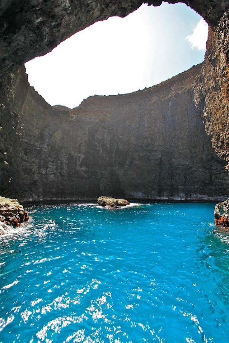 the water is blue and clear in this cave