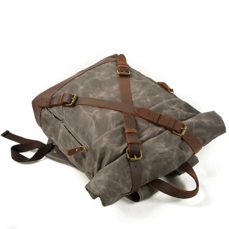 Embrace your adventurous spirit with our rugged and stylish vintage canvas and leather rucksack. Designed for the modern adventurer, this backpack combines classic design with practical features to support your journeys, whether in the city or the wilderness. Rugged Comfort: At just 1 kg, this 20-liter retro waxed rucksack offers lightweight comfort without compromising on durability. The padded shoulder straps ensure ease of carrying, even on longer trips. Modern Meets Tradition: The sleek desi Canvas Rucksack Backpack, Leather Travel Backpack, Wax Canvas, Waxed Canvas Backpack, Canvas Rucksack, Anti Theft Backpack, Outdoor Backpacks, Leather Rucksack, Practical Bag