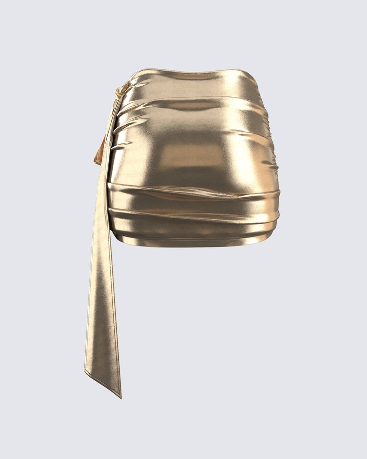 This golden drape skirt is your key to instant glam ✨ Made from lame jersey fabric, and complete with an asymmetrical hem, sash detail, ruching detail, and an elastic waistband - this skirt has a luminous allure perfect for stealing the spotlight anywhere you go 😌 Glamorous Gold Mini Skirt, Gold Mini Skirt For Evening, Gold Mini Skirt For Night Out, Chic Ruched Party Skirt, Chic Ruched Skirt For Party, Chic Gold Mini Skirt For Party, Glamorous Gold Mini Skirt For Night Out, Party Draped Skirt With Ruched Detail, Party Skirt With Ruched Draped Design