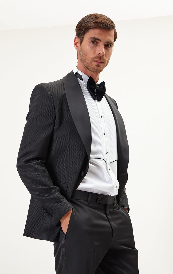 DETAILS If you find your evening event calendar filling up fast, it might be time to boost your black tie attire with a luxurious dinner jacket, like our classic black style. Made from a textured lustrous fabric with tactile irregularities on the surface, it's tailored with elegant shawl lapels and fastens with covered buttons for a streamlined finish. The full lining reinforces the fine cloth and means it'll layer smoothly over your shirt. The suit consists of a tuxedo jacket and a pair of pant Elegant Outerwear With Suit Collar For Semi-formal Occasions, Elegant Fitted Outerwear For Black-tie Events, Elegant Suits With Lapel Collar And Hidden Button Closure, Elegant Fitted Blazer For Black-tie Events, Tuxedo Suits With Structured Boning And Long Sleeves, Elegant Single Breasted Outerwear For Black-tie Events, Black Structured Boning Outerwear For Evening, Elegant Single Breasted Blazer For Black-tie Events, Elegant Single-breasted Outerwear For Black-tie Events