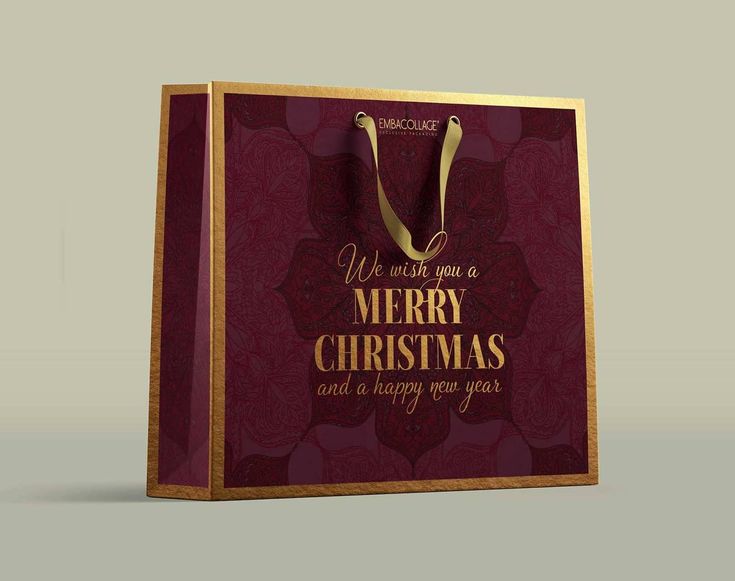 a red and gold christmas shopping bag with the words we wish you a merry christmas