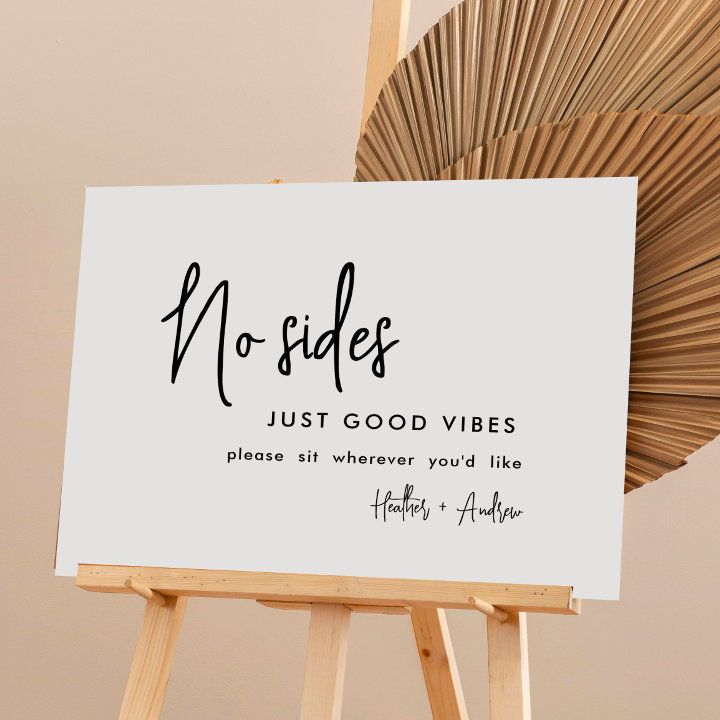 a wooden easel with a sign on it that says no sides just good vibes