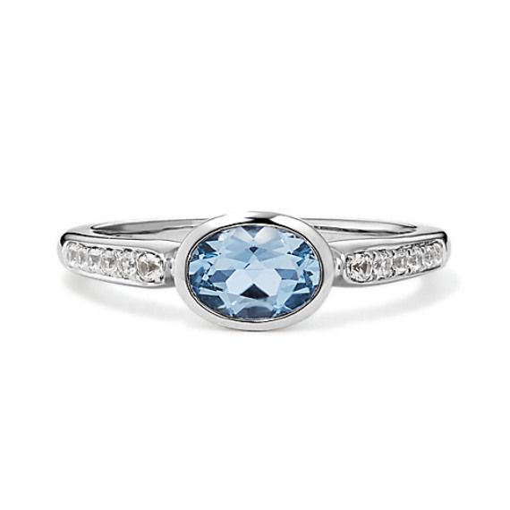 Sweet and sophisticated  this ring features a gorgeous natural aquamarine gemstone for a splash of color. Crafted in bright 14-karat white gold  natural white sapphire accents round out the design with a touch of sparkle. Classic White Gold Diamond Ring With Blue Topaz, Aquamarine Topaz Ring In White Gold, Formal Aquamarine Birthstone Ring In White Gold, White Gold Topaz Ring With Aquamarine Birthstone, Formal White Gold Aquamarine Birthstone Ring, White Gold Aquamarine Birthstone Ring For Formal Occasions, Elegant Light Blue Brilliant Cut Ring, Modern White Gold Birthstone Ring With Accent Stones, Elegant Light Blue Topaz Ring With Accent Stones