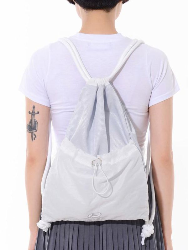 Editor's notesEx Nylon Gym Sack by PIECEMAKER is made of lightweight nylon material, which makes it convenient to carry around without adding much weight. On the front side of the bag, there is additional storage space provided using a stopper, allowing you to store extra items or accessories. The bag features a thick shoulder strap made with a special jacquard material, ensuring comfort while carrying it. As a visual accent, there is artwork logo embroidery on the front of the bag, adding a uni Nylon Casual Gym Bag For Sports, Functional Sports Backpack With Pockets, Nylon Gym Bag With Pockets For Outdoor Activities, Nylon Gym Bag For Sports, Functional Nylon Backpack With Pockets, Gym Nylon Bag With Pockets, Sports Nylon Bags With Pockets, Sporty Nylon Bags For Daily Use, Casual Nylon Gym Bag For Daily Use