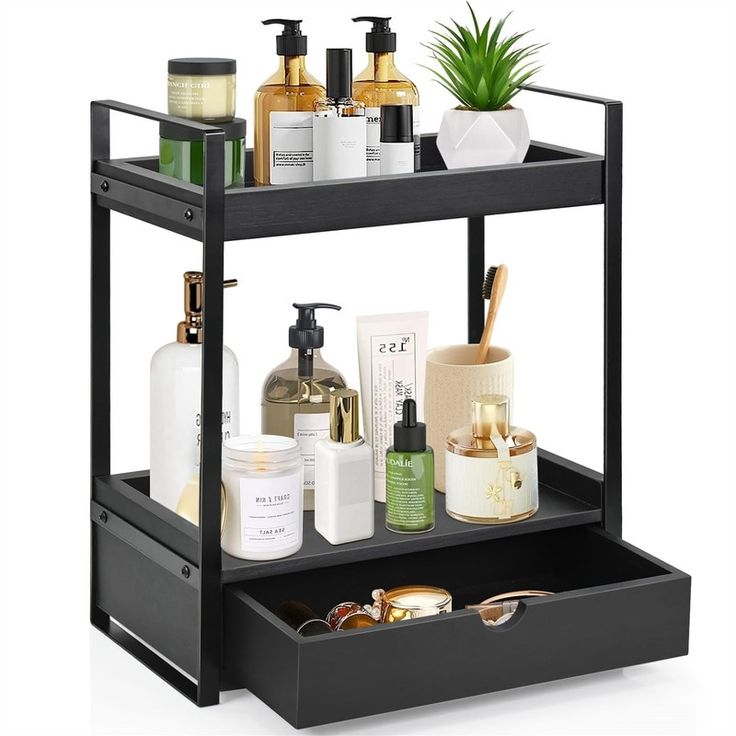 a black shelf with some bottles and soaps on it's sides, along with other bathroom items