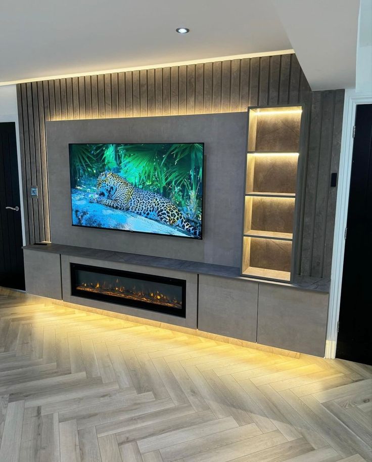 a large flat screen tv mounted to the side of a wall in a living room