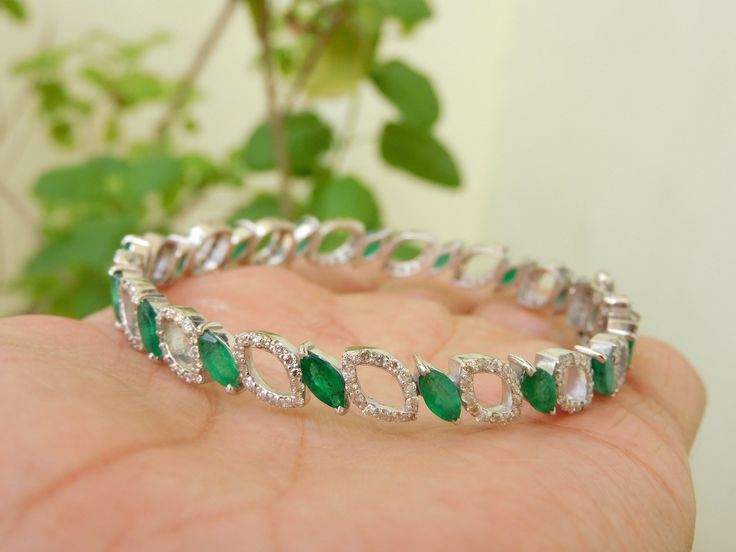 Natural emerald and diamond bracelet bangle for women and girls in 14k solid gold / surprised your love with this beautiful bangle bracelet With Gold / Gift Emerald Bangle Bracelet .... --------------------------------------------------------------------------------- Item description - stone - natural emerald shape - Marquise color - rich green luster weight - 9.10 carats Quality - AA size 3 mm width and 5 mm length total emerald stones - 24 pieces orgin - zambian material - 14k and 18k solid go Diamond Accents Bangle Bracelet Gift, Fine Jewelry Emerald Diamond Bracelet For Wedding, Emerald Diamond Bracelet For Wedding, Wedding Emerald Diamond Bracelet, Emerald Bangle Bracelet For Anniversary, Jeweled Round Bangle As Gift, Green Bangle Bracelet For Anniversary, Green Bangle Bracelets For Anniversary, Elegant May Birthstone Bangle For Gift