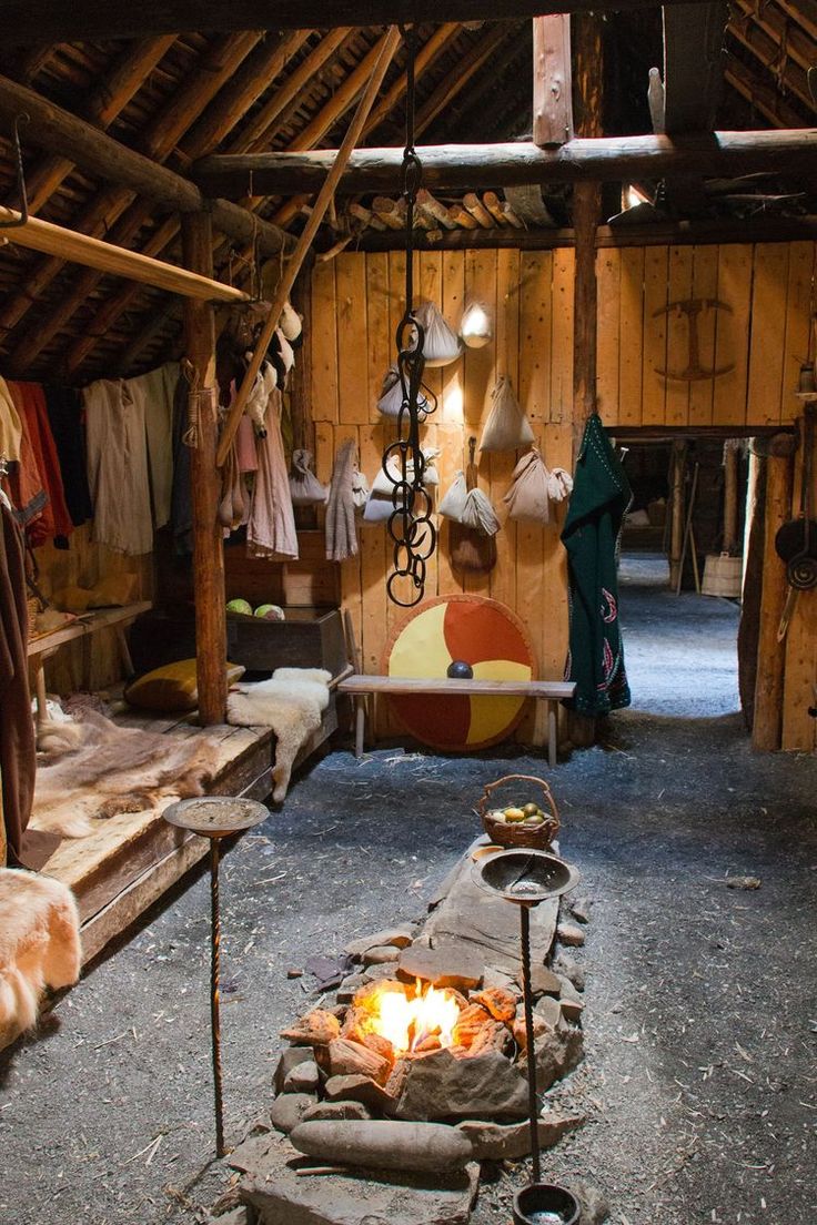 an open fire pit in a rustic looking room