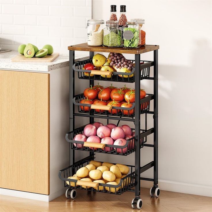 a kitchen cart filled with fruits and vegetables on top of a hard wood floor next to a counter