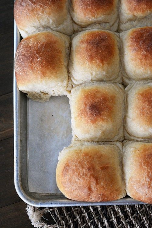 bread rolls in a baking pan on a table