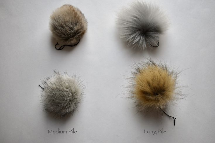 four different types of fur pom poms