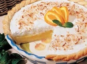 there is a pie with oranges on the table