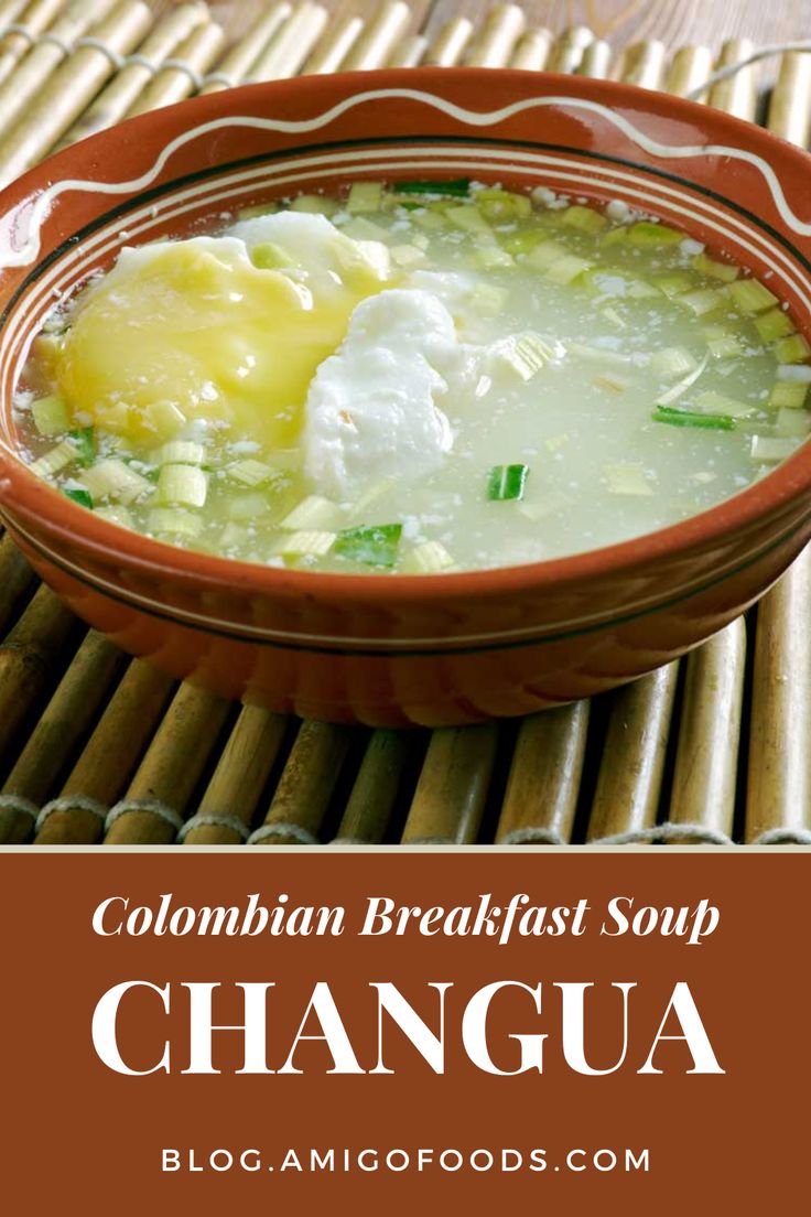 a close up of a bowl of soup on a table with the words, colombia breakfast soup