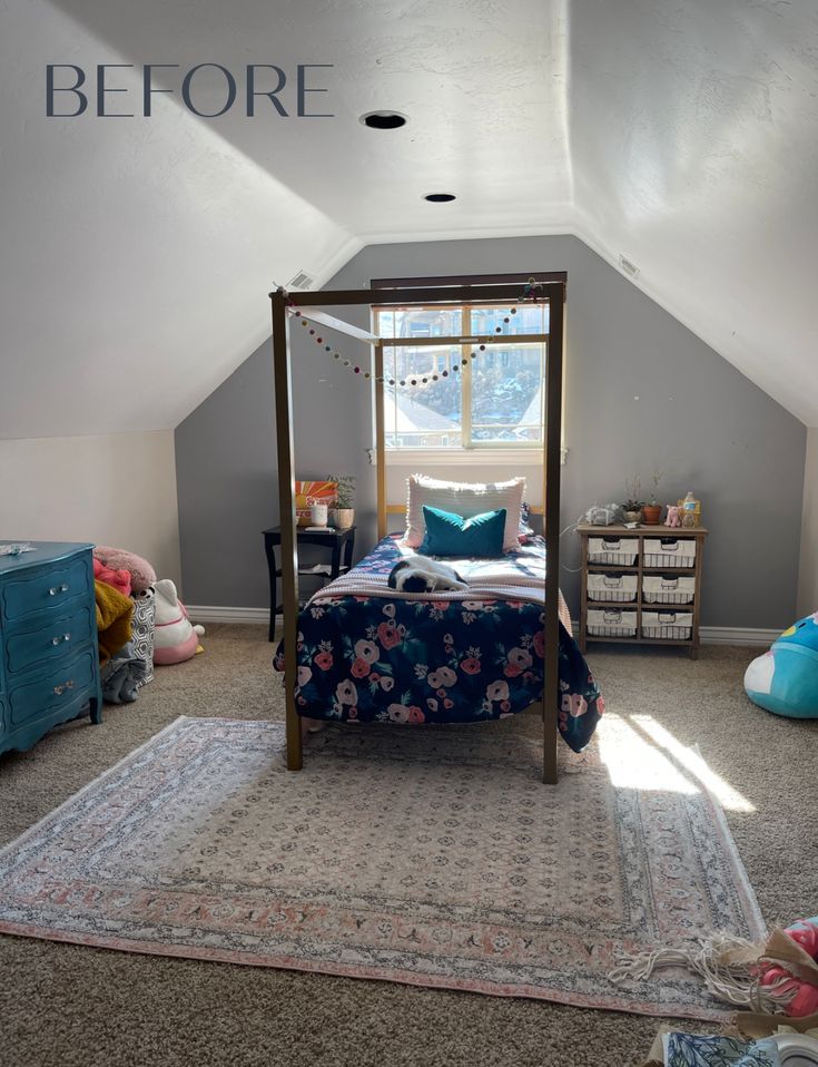 a bedroom with a canopy bed, dresser and rug in the middle of the room