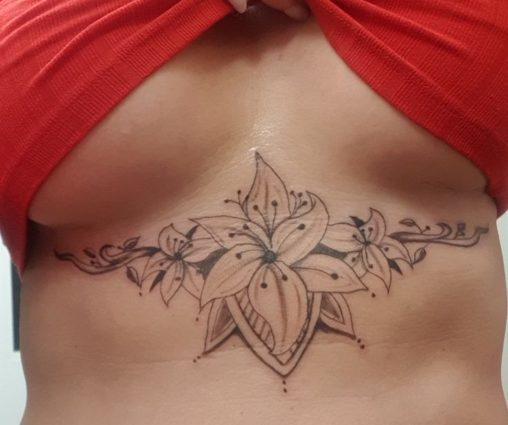 a woman with a tattoo on her stomach