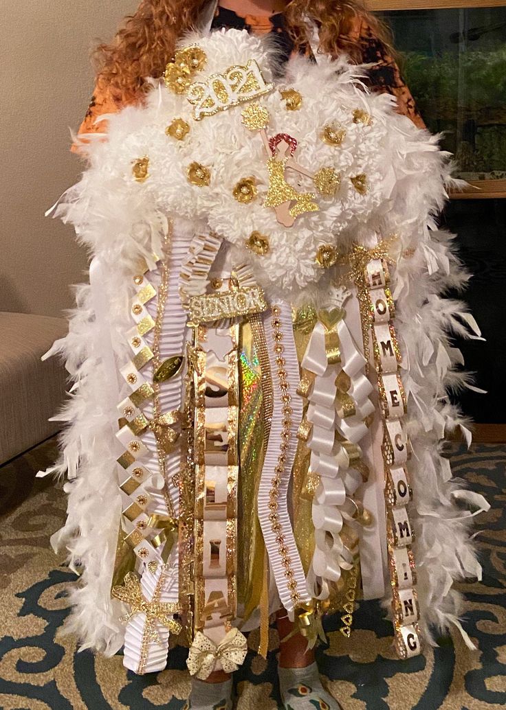 a woman wearing a costume made out of feathers and ribbons