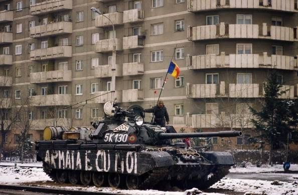 an army tank is parked in the snow