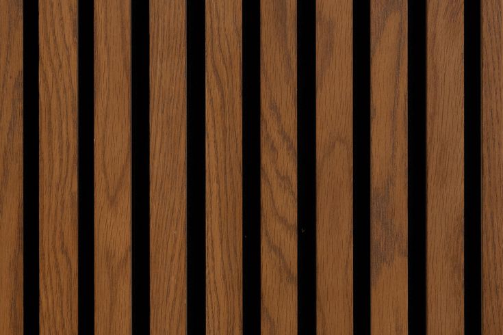 closeup of the wood grains on a wooden door with vertical stripes in brown and black