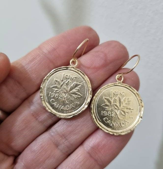 "14k gold earrings, Coin earrings, Dangle coin earrings, Coin Pendant earrings, Antique Coin earrings, Gold drop earrings, Gold coin earrings Coin earrings, delicate and beautiful, made of an old Canadian coin attached to a 14k gold filled hook, making them a great pair of gold dangle earrings for everyday wear. The coin earrings is made of an original coin which I decorated with hammered wires and plated with 14k gold. Dimensions: The earrings diameter is about 0.8\" (2 cm). The drop length, in Elegant 14k Gold-filled Coin Pendant Jewelry, Elegant 14k Gold Filled Coin Pendant Jewelry, Everyday Gold Plated Coin Jewelry, Vintage Coin-shaped Tarnish Resistant Jewelry, Vintage Tarnish-resistant Coin-shaped Jewelry, Vintage Tarnish-resistant Coin Jewelry, Elegant Nickel-free Medallion Earrings, Yellow Gold Coin Pendant Dangle Jewelry, Yellow Gold Dangle Coin Pendant Jewelry