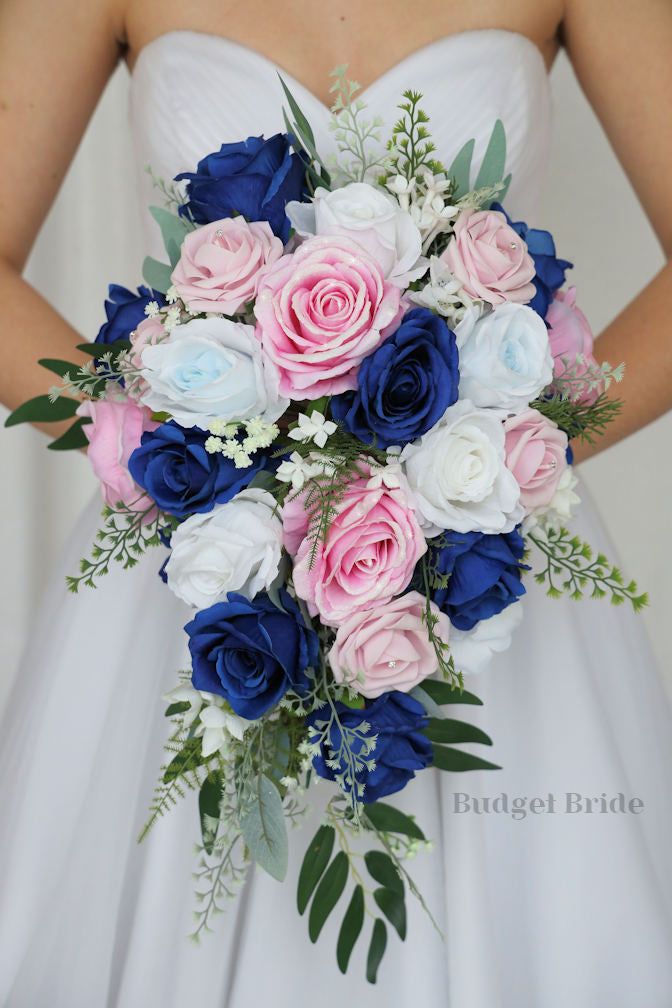 a bridal holding a bouquet of pink and blue flowers